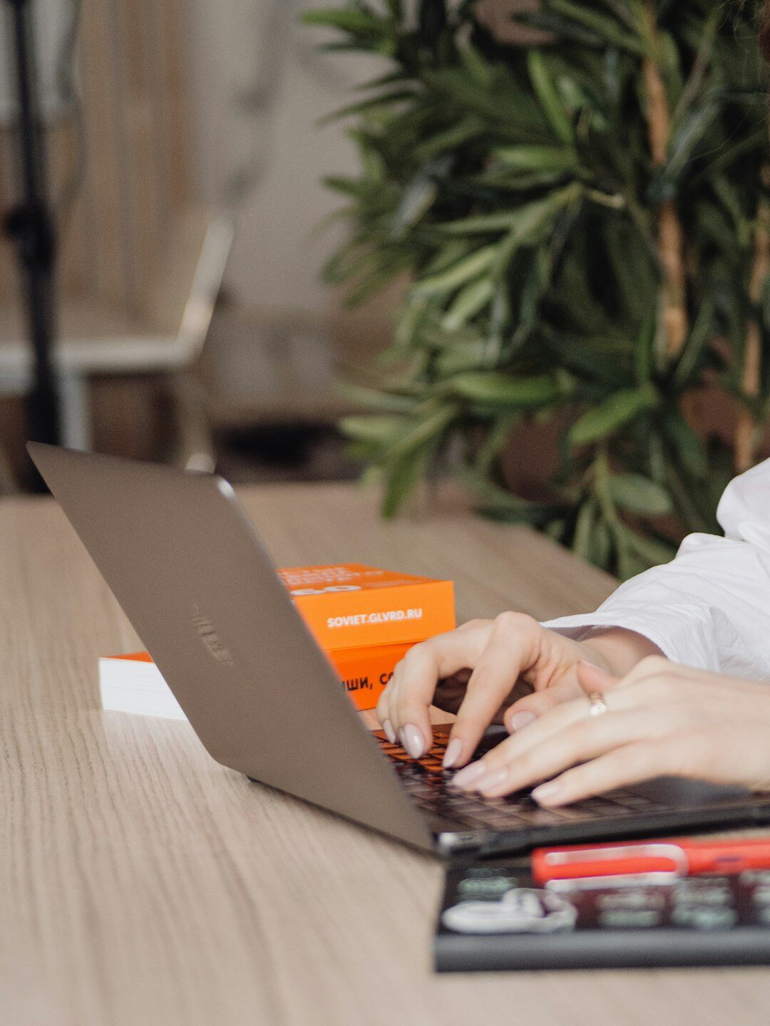 person calculating expenses on laptop