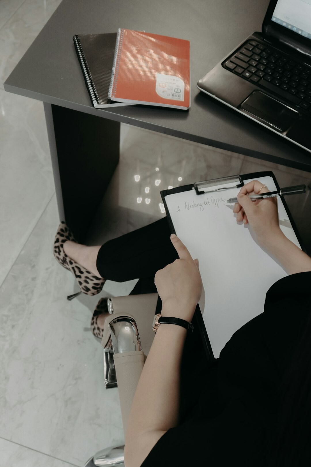 person reviewing insurance papers at desk